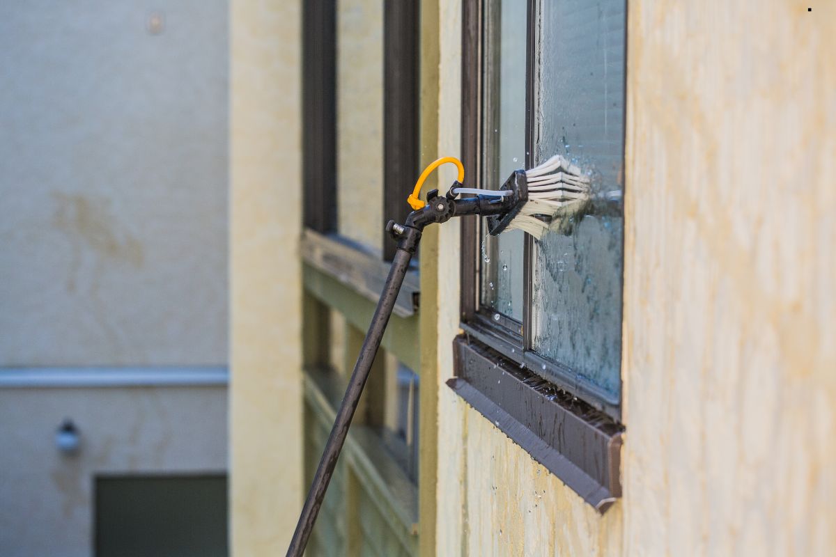 A window cleaning machine in action, effectively cleaning a large window for a professional window cleaning service.
